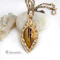 This necklace features a golden brown carved Mother of Pearl leaf accented against a handcrafted gold brass base. I hand sawed the base out of solid gold brass sheet and stamped the metal with a leaf pattern to "echo" the Mother of Pearl leaf. Unique and one-of-kind, it'll make a great gift for a nature lover - or a nice addition to your own jewelry wardrobe. It comes on an 18" antiqued brass chain with lobster claw closure. Handmade in the USA by Silver and Earth Jewelry. 