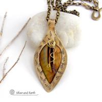 This necklace features a golden brown carved Mother of Pearl leaf accented against a handcrafted gold brass base. I hand sawed the base out of solid gold brass sheet and stamped the metal with a leaf pattern to "echo" the Mother of Pearl leaf. Unique and one-of-kind, it'll make a great gift for a nature lover - or a nice addition to your own jewelry wardrobe. It comes on an 18" antiqued brass chain with lobster claw closure. Handmade in the USA by Silver and Earth Jewelry. 