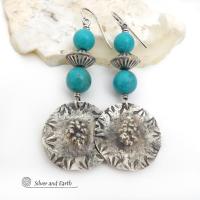 These handcrafted sterling silver earrings have a rustic hammered and hand stamped texture and are accented with a stack of turquoise and sterling silver beads. The silver beads have a fluted corrugated texture and an oxidized satin finish. Bold and striking, they have an earthy organic vibe with southwest style and flair that will look great with all types of outfits. Handmade by Silver and Earth, a New Mexico True Certified business. 