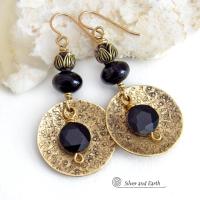 These handcrafted earrings feature gold brass dangles with a hand stamped texture accented with round black onyx gemstones dangling in front and topped off with black onyx gemstones and tulip flower-shaped beads. They have a modern, elegant chic style that looks great dressed up or down. Perfect for women that love bold unique artisan handcrafted jewelry. They'll make a great wife gift for couples celebrating their 7th anniversary - onyx is the gemstone for this occasion. USA Handmade by Silver and Earth. 