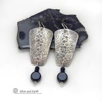 These handcrafted solid sterling silver earrings have a hammered and hand stamped texture and are accented with a dangling stack of black onyx gemstones. They have a rustic, edgy, organic vibe with a modern, contemporary style that makes a bold statement.