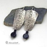 These handcrafted solid sterling silver earrings have a hammered and hand stamped texture and are accented with a dangling stack of black onyx gemstones. They have a rustic, edgy, organic vibe with a modern, contemporary style that makes a bold statement.