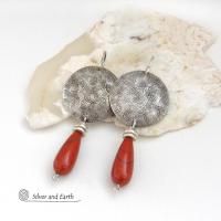 These handcrafted sterling silver earrings have a hand stamped texture and feature slender teardrop-shaped red jasper gemstones dangling from the bottom. The stones are a beautiful shade of burnt red with subtle natural black inclusions. The design is modern, contemporary, classic and always in fashion. 
