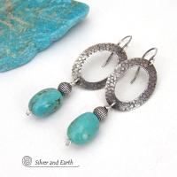 These handcrafted earrings feature hand stamped sterling silver oval hoops accented with natural turquoise stone nuggets and textured silver plated beads. They have a chic modern style with touch of southwestern flair that will coordinate beautifully with all wardrobe types. 
