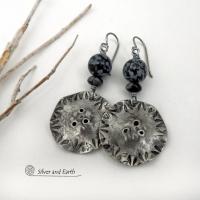 Handcrafted earrings with a modern bold edgy vibe. They feature rustic hammered and hand stamped silver tone pewter dangles accented with natural snowflake obsidian gemstones. The stones have a natural pattern in hues of black and soft gray. This stone is a natural volcanic glass which contains the mineral cristobalite - which creates the "snowflake" type patterns. Bold and striking - they're sure to make a statement. Perfect for women that love natural stones and unique artisan handmade jewelry. 