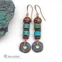 These handmade earrings feature natural turquoise stones accented with copper beads and organically shaped "rings" of copper with a soft turquoise patina finish. They have a modern chic bohemian style with a touch of exotic flair that makes a unique, bold statement. Handmade in the USA by Silver and Earth Jewelry.