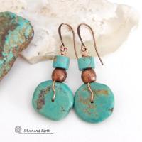 Chunky natural turquoise gemstones are wrapped in copper wire and are accented with copper and turquoise beads in these modern southwest style earrings. They have a casual, earthy style and will make a great gift for anyone that loves natural turquoise stone jewelry - or a nice addition to your own jewelry wardrobe. Handmade in the USA by Silver and Earth Jewelry. 