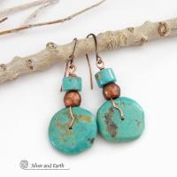 Chunky natural turquoise gemstones are wrapped in copper wire and are accented with copper and turquoise beads in these modern southwest style earrings. They have a casual, earthy style and will make a great gift for anyone that loves natural turquoise stone jewelry - or a nice addition to your own jewelry wardrobe. Handmade in the USA by Silver and Earth Jewelry. 