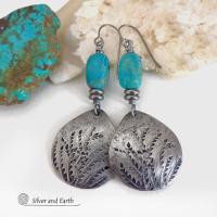 These handcrafted earrings feature silver pewter teardrop-shaped dangles with a hand stamped feather texture accented with natural turquoise stones and small stainless steel beads. They have a modern earthy style with lots of boho chic southwestern flair. They'll make a great gift for anyone that loves natural turquoise stones and southwest style jewelry. Handmade in the USA by Silver and Earth jewelry, a NM True Certfied Business. 