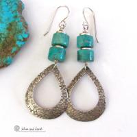 These handcrafted earrings feature textured sterling silver hoop dangles accented with a stack of turquoise stones. They have a modern, chic flair and will look great with all wardrobe styles. Tiny pewter beads were added as an accent. Earrings are lightweight and comfortable to wear. Handmade in the USA by Silver and Earth jewelry.