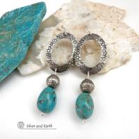 These handcrafted earrings feature hand stamped sterling silver oval hoops accented with natural turquoise stone nuggets and textured silver plated beads. They have a chic modern style with touch of southwestern flair that will coordinate beautifully with all wardrobe types. Handmade in the USA by Silver and Earth Jewelry. 