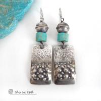 These handcrafted earrings feature sterling silver rectangles with a hammered and hand stamped texture accented with natural turquoise stones. They are topped off with oxidized and stamped Native American made sterling silver beads.They have a modern, southwest tribal style and will make a bold statement. Perfect for anyone that loves southwest style jewelry. The earrings are handmade and are a beautiful example of southwest style jewelry. Handmade by Silver and Earth, a New Mexico True Certified business.