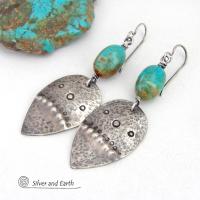 These handcrafted earrings feature natural turquoise nuggets accented with sterling silver dangles with a hammered and hand stamped texture. The stones are a gorgeous shade of turquoise with a natural copper matrix. They have an earthy organic, modern style with southwestern flair.