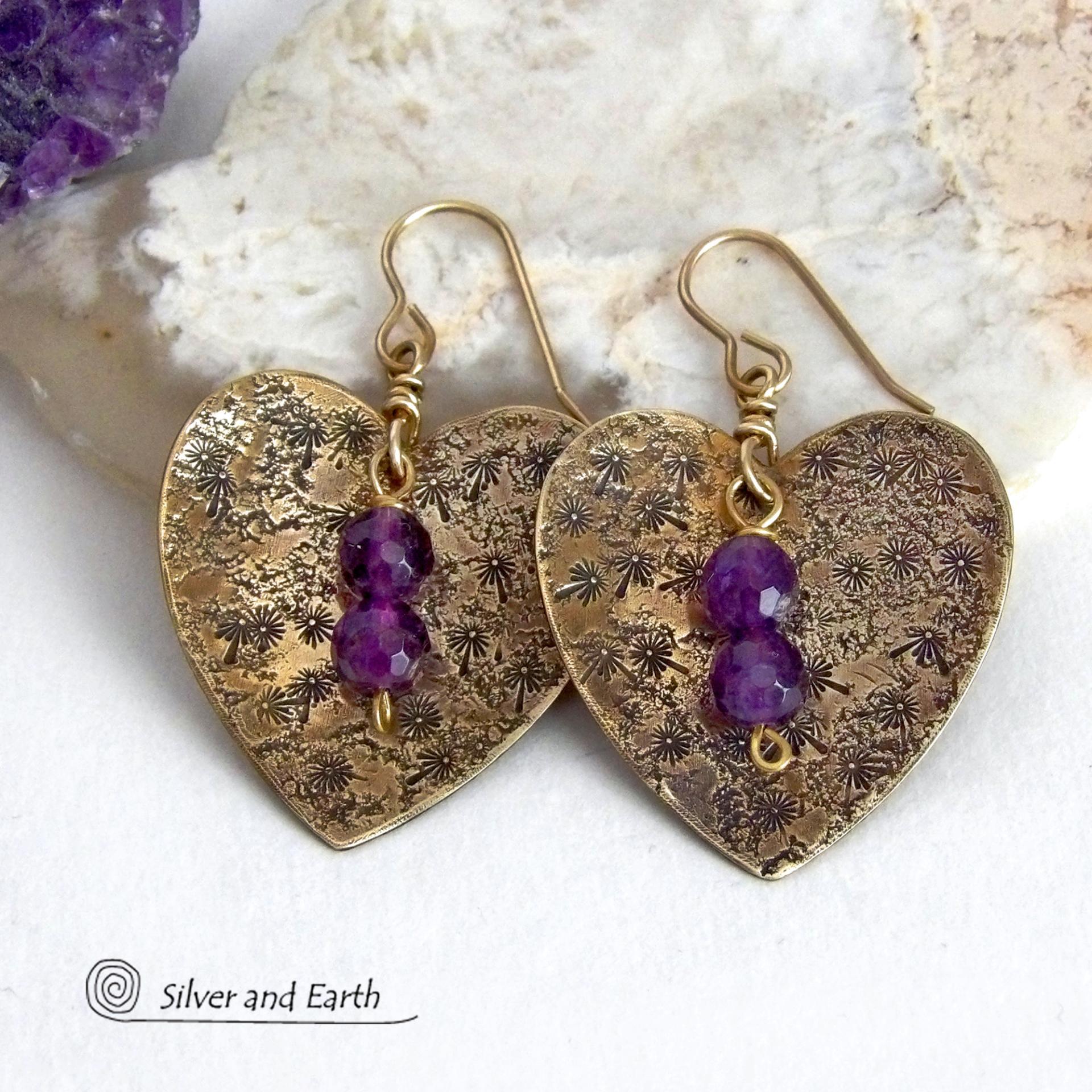 These gold brass heart earrings have a romantic, feminine charm and will make a great gift for someone special. They feature handcrafted gold brass hearts with a hand stamped texture accented with faceted amethyst gemstones dangling in front. The perfect gift to say "I love you" on Valentine's Day or any day! They'll also make a great gift for someone born in February - amethyst is the birthstone for this month.  Makes a great gift for couples celebrating their 21st wedding anniversary.