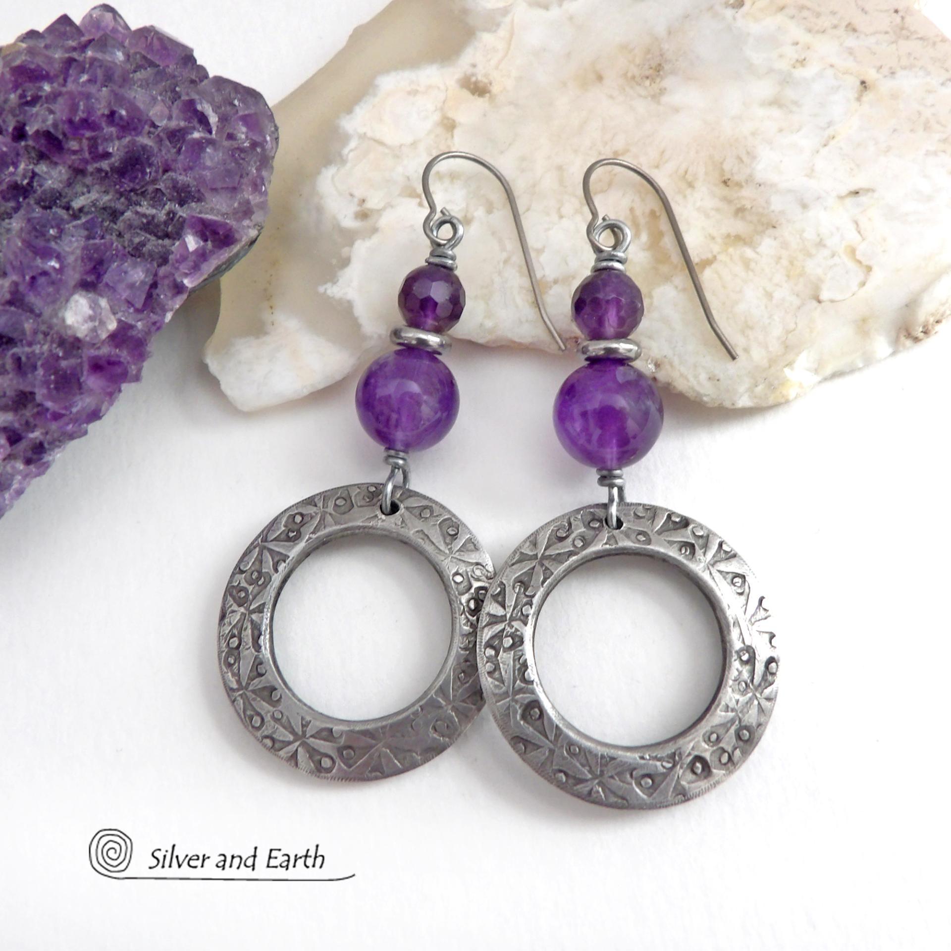 These handcrafted silver pewter hoop earrings have a hand stamped texture and are accented with a stack of purple amethyst gemstones and tiny stainless steel spacer beads. They have a modern, elegant chic style that will look great with all wardrobe styles - dressed up or down. Makes a great gift for someone with a February birthday - amethyst is that month's birthstone. Handmade in the USA by Silver and Earth Jewelry.