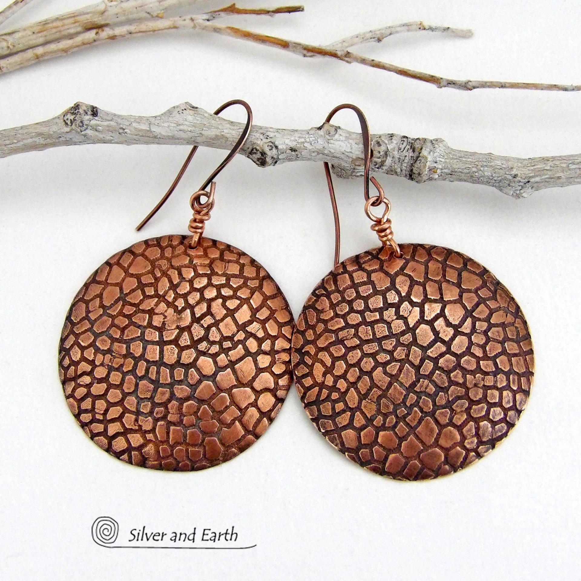These handcrafted copper earrings have a beautifully detailed embossed cobblestone texture. Big and bold, they'll make a striking statement. Unique and versatile, they are lightweight and comfortable to wear and will look great with all wardrobe styles. Handmade in the USA by Silver and Earth Jewelry. Your choice of ear wire - copper or hypoallergenic niobium.