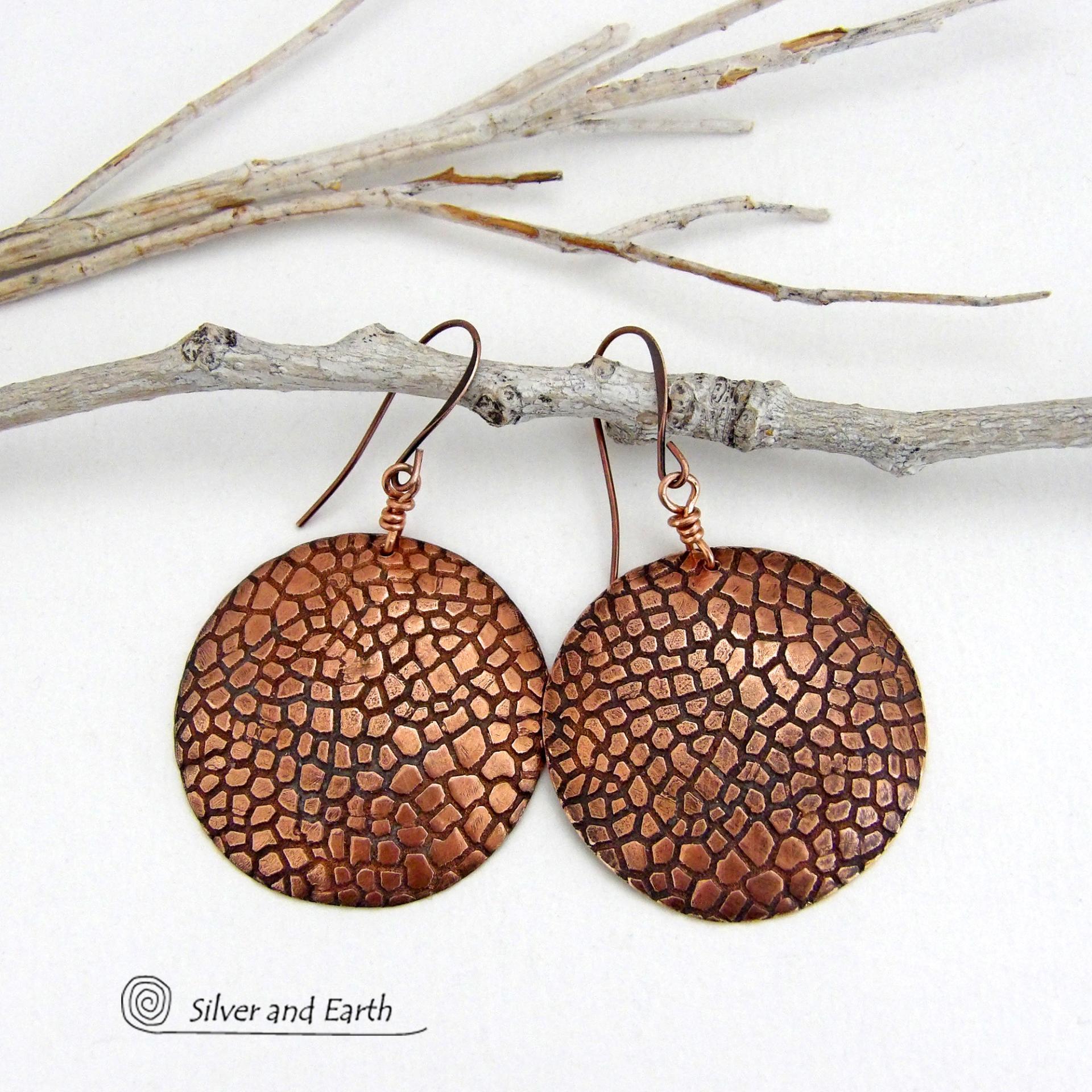 These handcrafted copper earrings have a beautifully detailed embossed cobblestone texture. Big and bold, they'll make a striking statement. Unique and versatile, they are lightweight and comfortable to wear and will look great with all wardrobe styles. Handmade in the USA by Silver and Earth Jewelry. Your choice of ear wire - copper or hypoallergenic niobium.