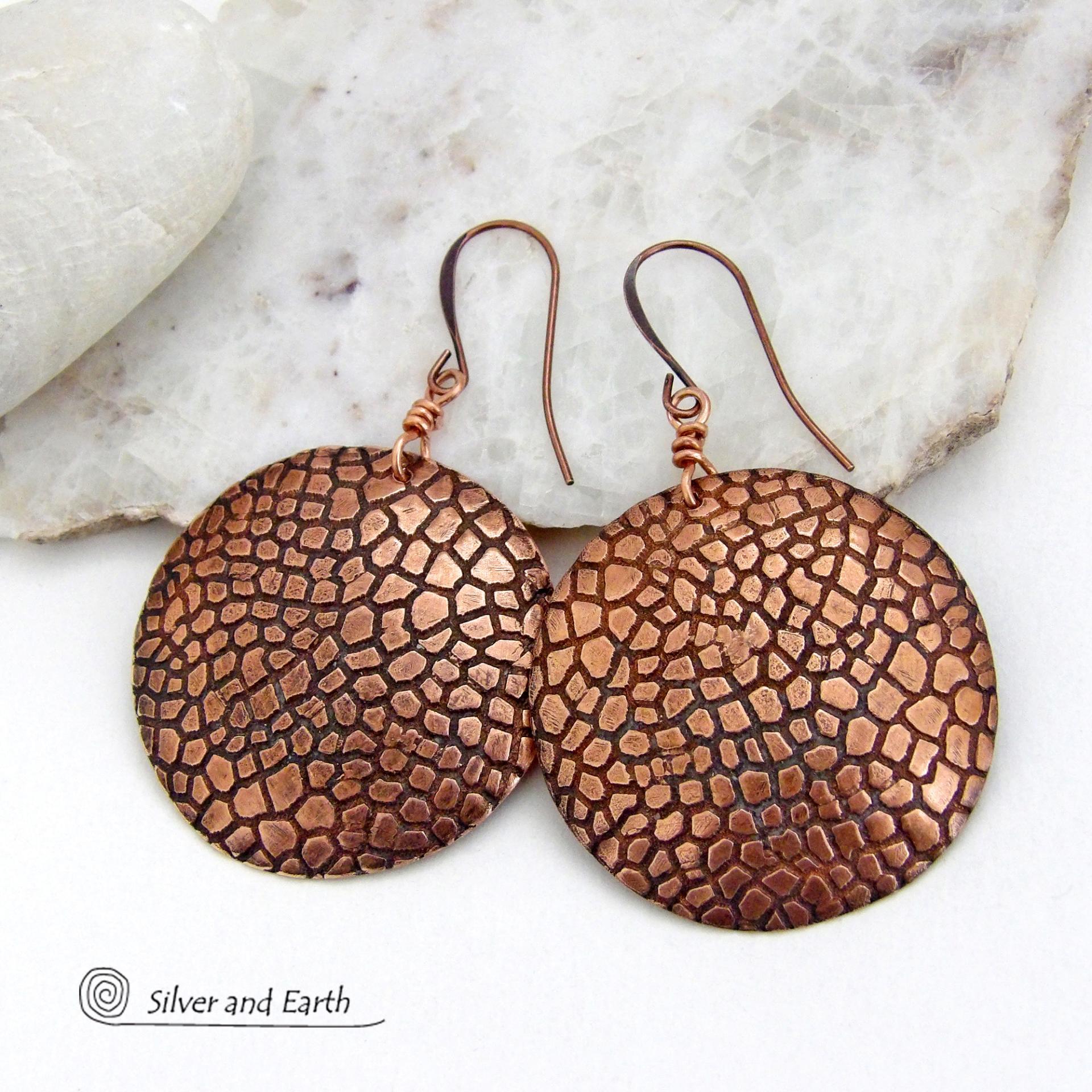 These handcrafted copper earrings have a beautifully detailed embossed cobblestone texture. Big and bold, they'll make a striking statement. Unique and versatile, they are lightweight and comfortable to wear and will look great with all wardrobe styles. Handmade in the USA by Silver and Earth Jewelry. Your choice of ear wire - copper or hypoallergenic niobium.