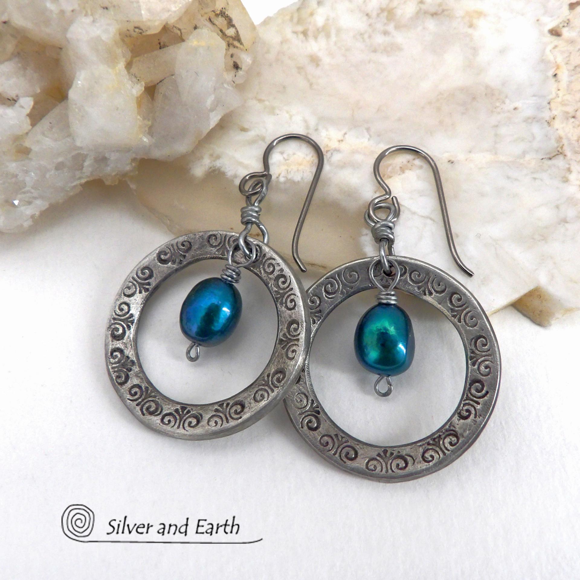 These handcrafted silver pewter hoop earrings have a hand stamped texture and are accented with beautiful blue freshwater pearls. They have a modern chic, classic style that is always in fashion and will coordinate beautifully with all wardrobe types. Makes a great gift for someone born in June. Pearl is the traditional gemstone for this month. Also makes a great wife gift for couples celebrating their 10th year of marriage. Pewter is the traditional metal for this occasion. Handmade in the USA by Silver an