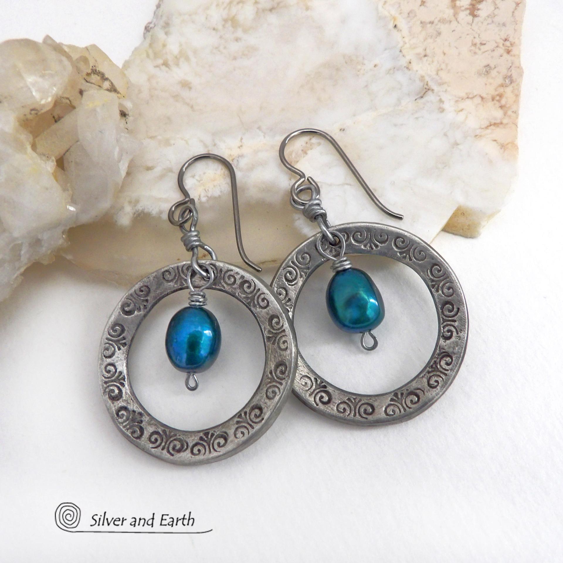 These handcrafted silver pewter hoop earrings have a hand stamped texture and are accented with beautiful blue freshwater pearls. They have a modern chic, classic style that is always in fashion and will coordinate beautifully with all wardrobe types. Makes a great gift for someone born in June. Pearl is the traditional gemstone for this month. Also makes a great wife gift for couples celebrating their 10th year of marriage. Pewter is the traditional metal for this occasion. Handmade in the USA by Silver an