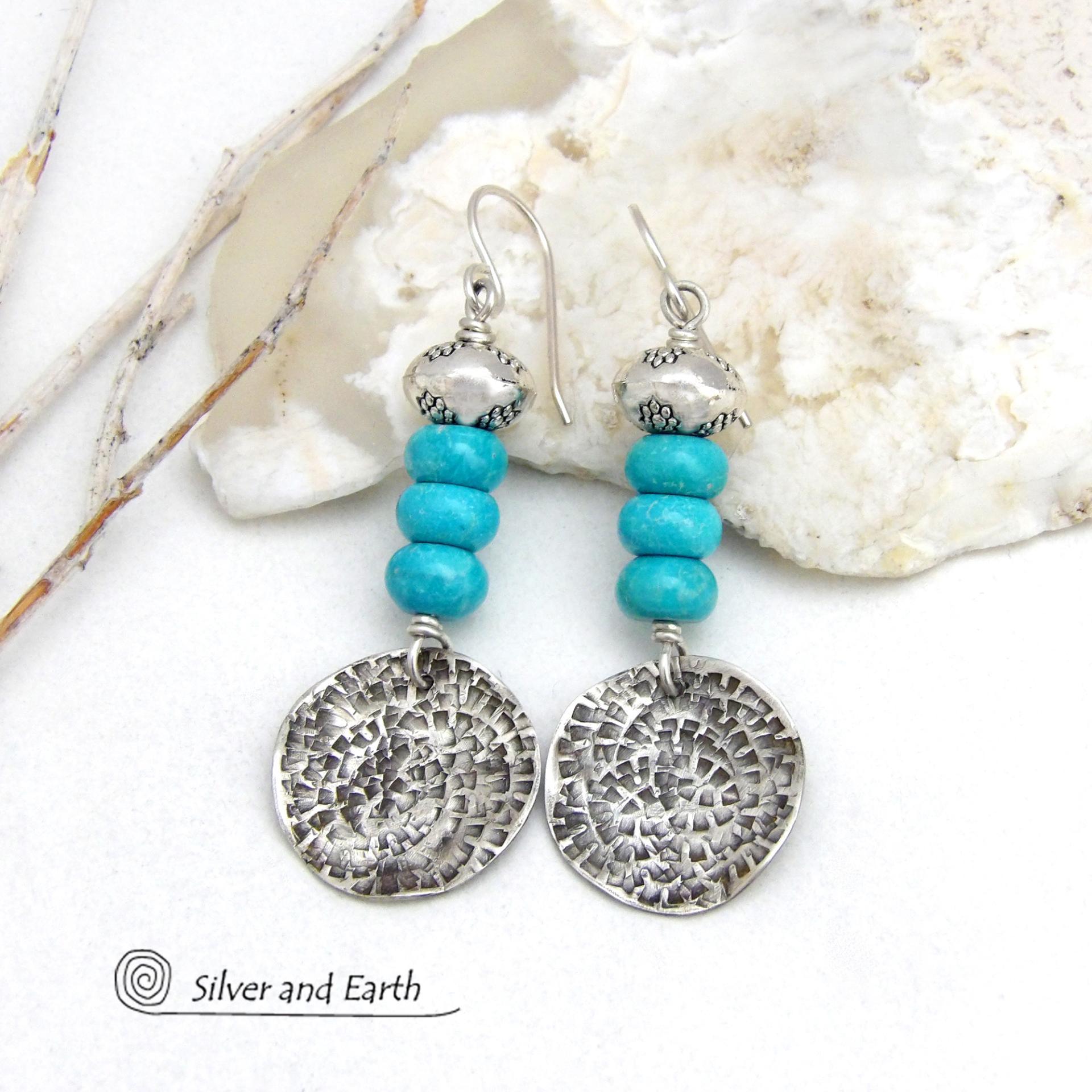 These handcrafted earrings feature textured sterling silver dangles accented with a stack of blue turquoise stones topped off with silver pewter beads. They have a modern chic style with a touch of southwestern flair and are perfect for anyone that loves the southwest style.  