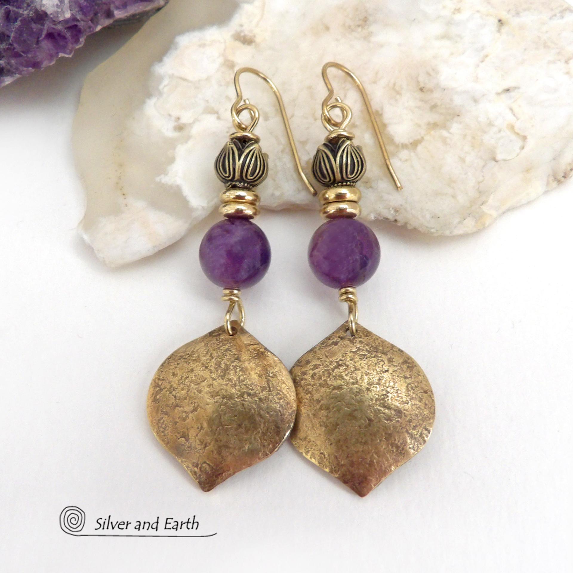 These handcrafted gold brass earrings have a hammered raw silk texture and are accented with natural purple amethyst gemstones, tiny brass beads and tulip flower-shaped brass beads. They have a modern elegant chic style that coordinates beautifully with all wardrobe types - dressed up or down. Makes a great gift for someone with a February birthday - amethyst is that month's birthstone. Handmade in the USA by Silver and Earth Jewelry. 