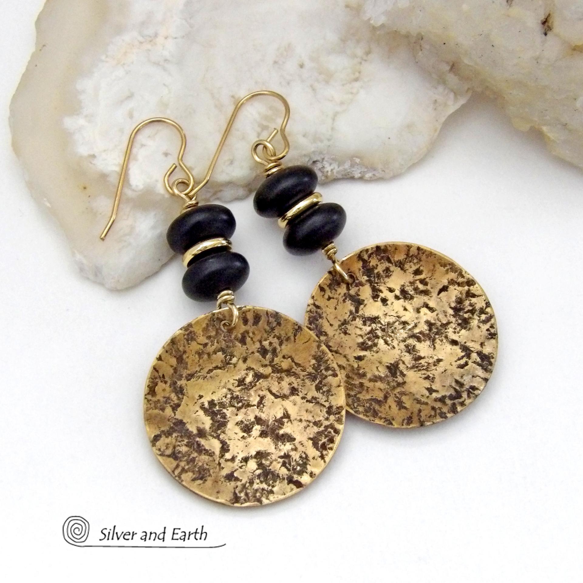 These handcrafted gold brass earrings have a hammered organic texture and are accented with black glass and shiny gold brass beads. They have a contemporary modern style with a timeless classic design that is always in fashion - dressed up or down. They'll coordinate beautifully with all wardrobe types. Makes a perfect 21st anniversary gift for your wife - brass is the traditional metal for this occasion. Handmade in the USA by Silver and Earth Jewelry. 