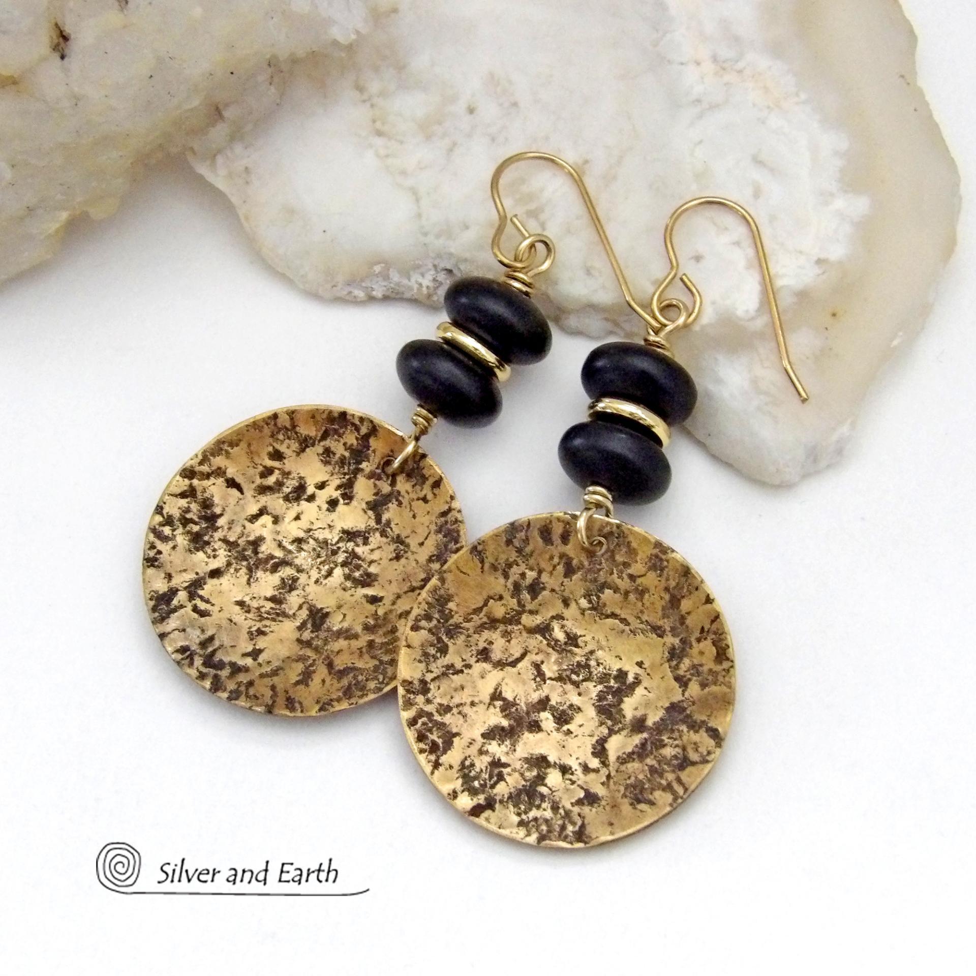 These handcrafted gold brass earrings have a hammered organic texture and are accented with black glass and shiny gold brass beads. They have a contemporary modern style with a timeless classic design that is always in fashion - dressed up or down. They'll coordinate beautifully with all wardrobe types. Makes a perfect 21st anniversary gift for your wife - brass is the traditional metal for this occasion. Handmade in the USA by Silver and Earth Jewelry. 