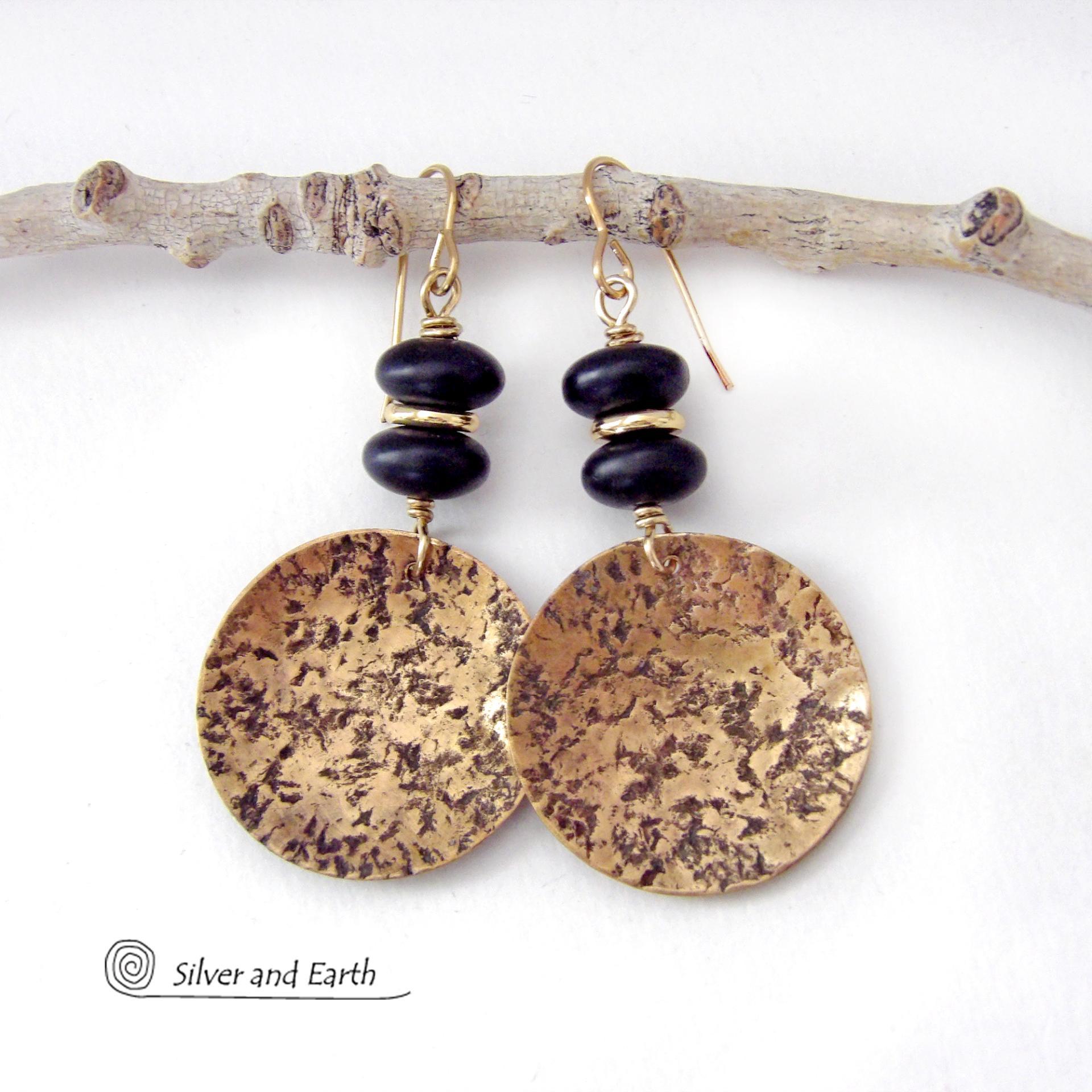 These handcrafted gold brass earrings have a hammered organic texture and are accented with black glass and shiny gold brass beads. They have a contemporary modern style with a timeless classic design that is always in fashion - dressed up or down. They'll coordinate beautifully with all wardrobe types. Makes a perfect 21st anniversary gift for your wife - brass is the traditional metal for this occasion. Handmade in the USA by Silver and Earth Jewelry. 