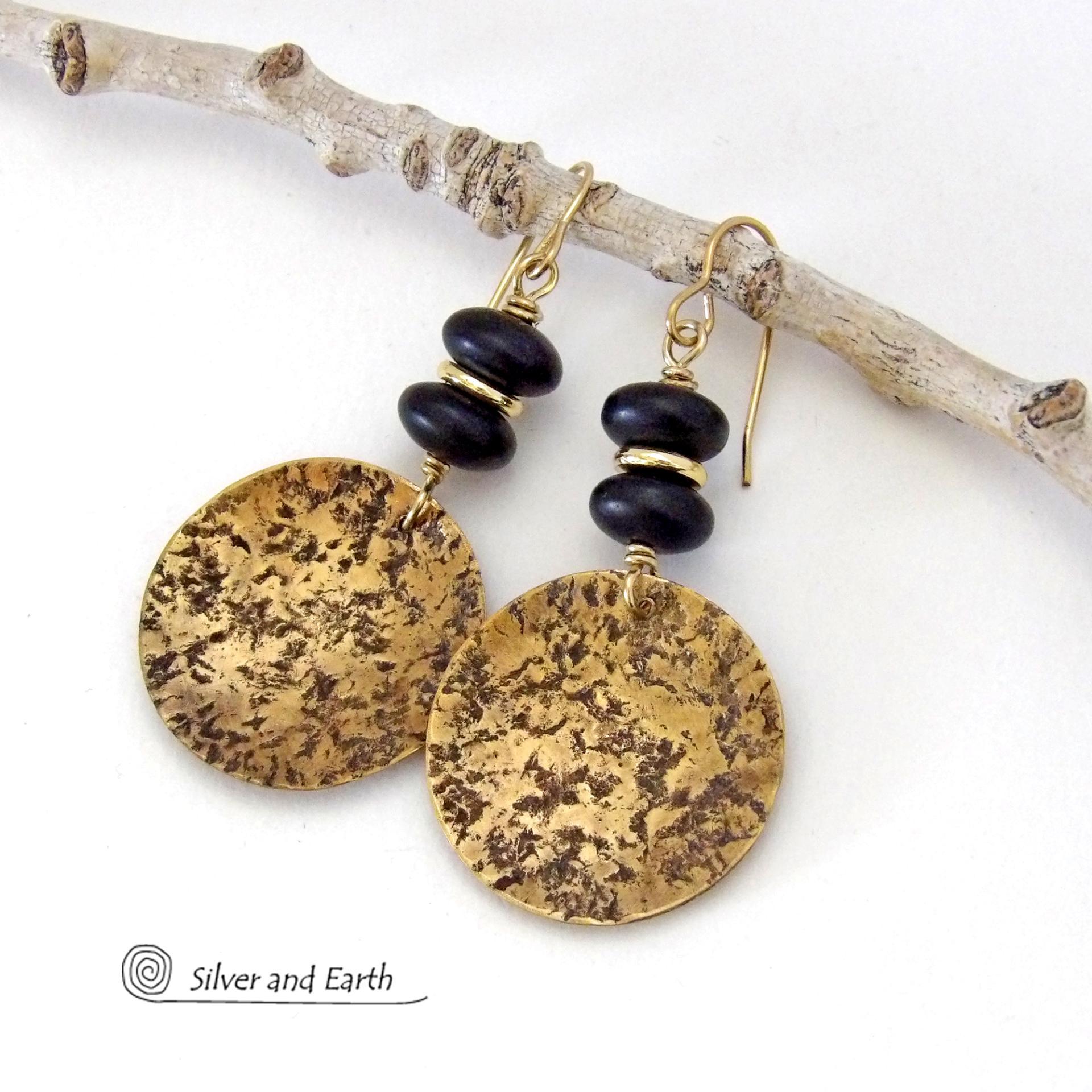 These handcrafted gold brass earrings have a hammered organic texture and are accented with black glass and shiny gold brass beads. They have a contemporary modern style with a timeless classic design that is always in fashion - dressed up or down. They'll coordinate beautifully with all wardrobe types. Makes a perfect 21st anniversary gift for your wife - brass is the traditional metal for this occasion. Handmade in the USA by Silver and Earth Jewelry. 