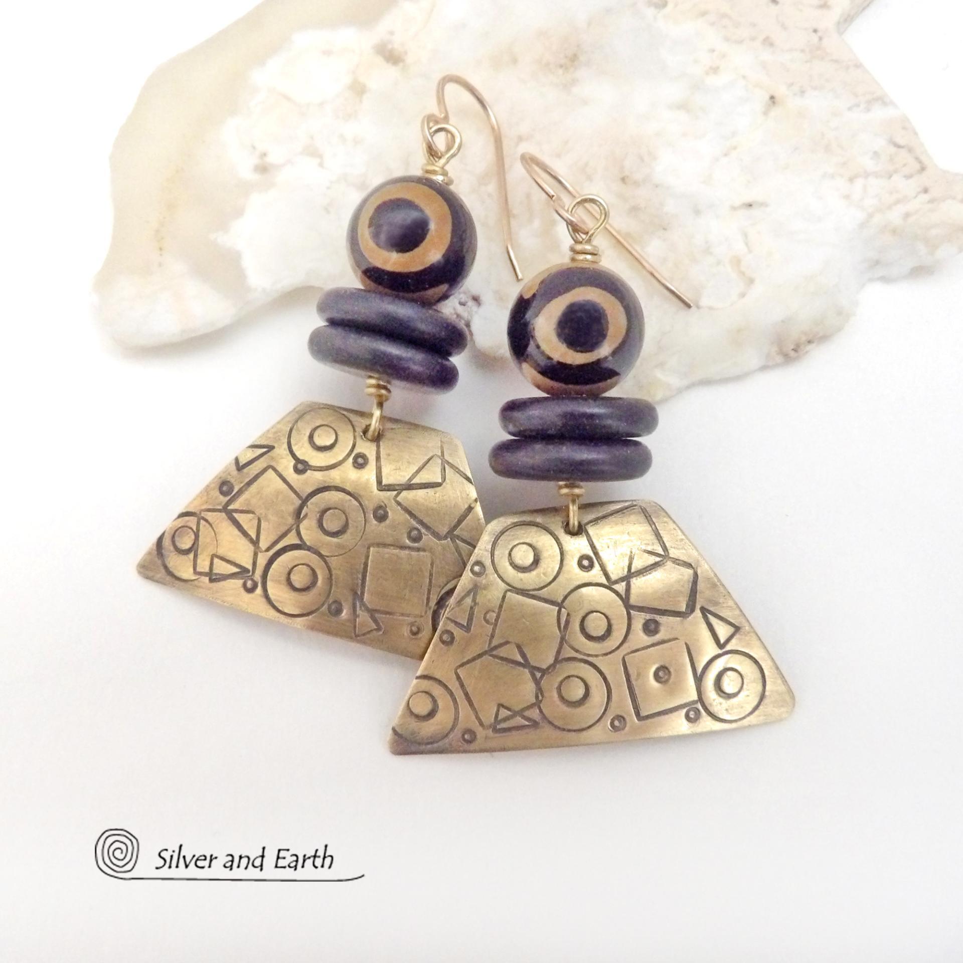 These handcrafted earrings have a mod, abstract hand stamped texture accented with brown and black Tibetan eye agate and black agate stones. Bold and unique - with an ethic tribal style - they'll make a striking statement. Makes a great gift for women that love bold statement jewelry. 