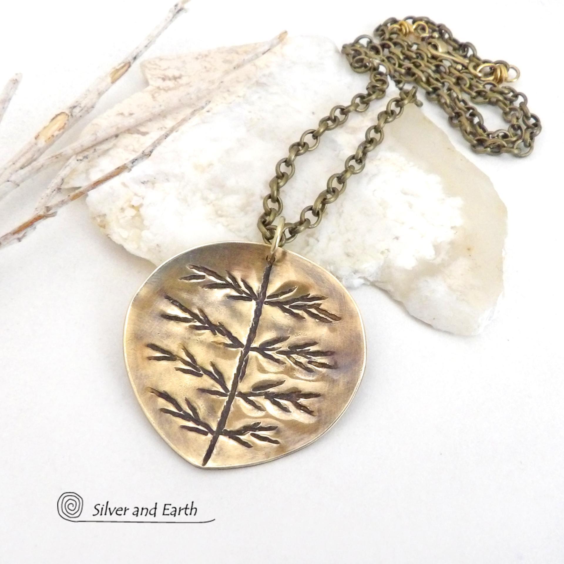 The perfect gift for nature lovers. This artisan handcrafted gold brass leaf pendant necklace has a modern earthy charm. It features a hand stamped texture pattern and comes on an 18" antiqued gold brass chain with lobster claw closure.