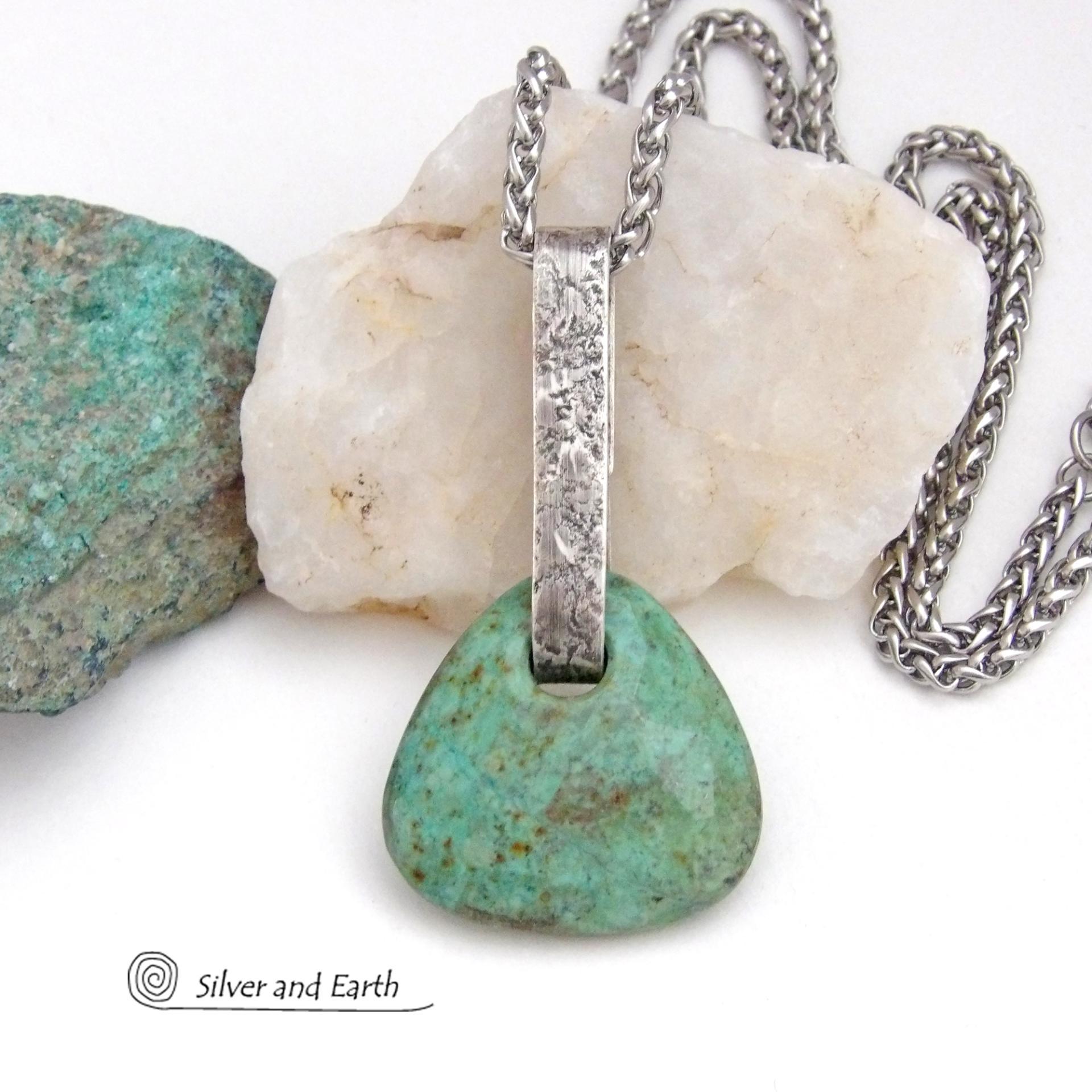 This one-of-a-kind pendant necklace features a beautiful chunky natural chrysocolla gemstone with a faceted finish. The stone is a beautiful shade of bluish-green which resembles turquoise. It hangs from a hand forged solid sterling silver bail with a lightly hammered organic texture. The stone is equally gorgeous on both sides, so I designed it to be reversible. (See all photos for alternate sides). Unique and one-of-a-kind, it's sure to make a statement. Makes a great gift for a natural stone lover - or a