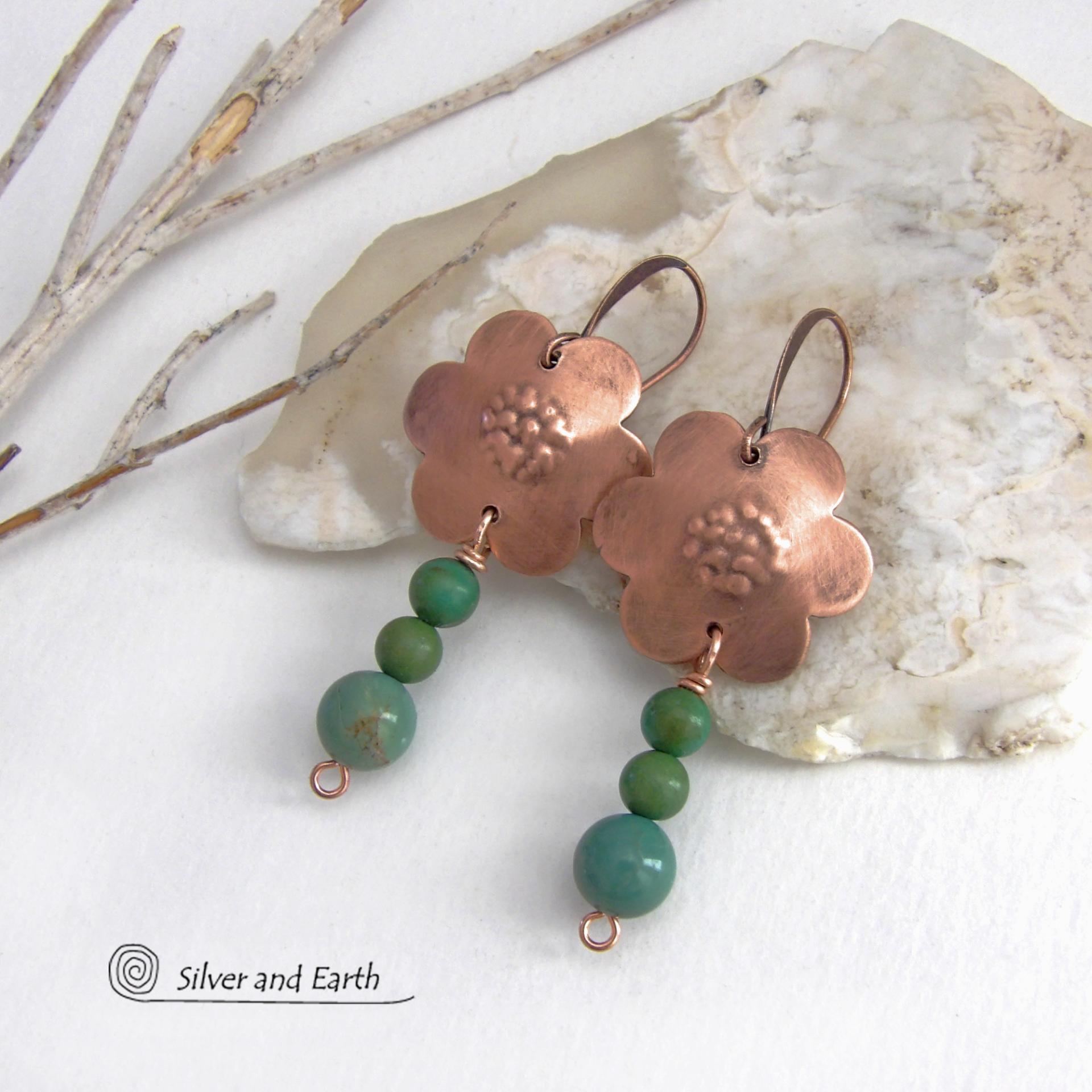 These hand forged copper flower earrings are accented with a stack of dangling turquoise stones. They have an earthy, whimsical charm and will make a great gift for nature / flower lovers and couples celebrating their seventh wedding anniversary. Copper is the traditional choice for this anniversary. Handmade in the USA by Silver and Earth Jewelry. 