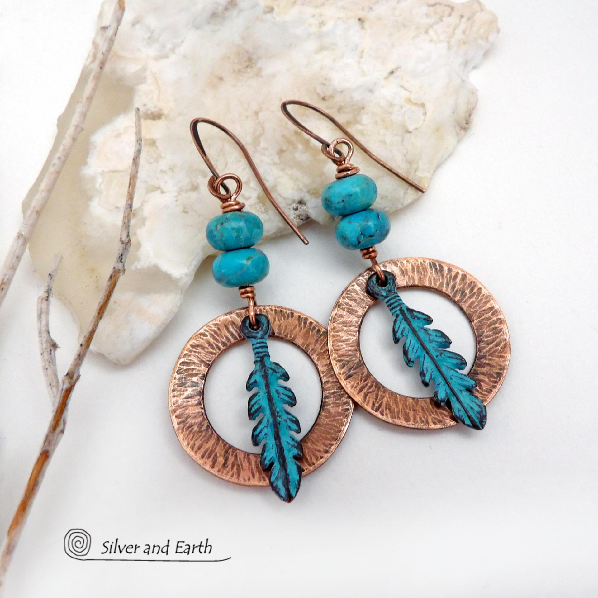 These handcrafted earrings feature round copper hoops with a hammered texture accented with a stack of turquoise beads and patina blue verdigris feathers. Lightweight and comfortable to wear - they'll add a touch of boho southwestern style to your wardrobe. Handmade in the USA by Silver and Earth Jewelry. 