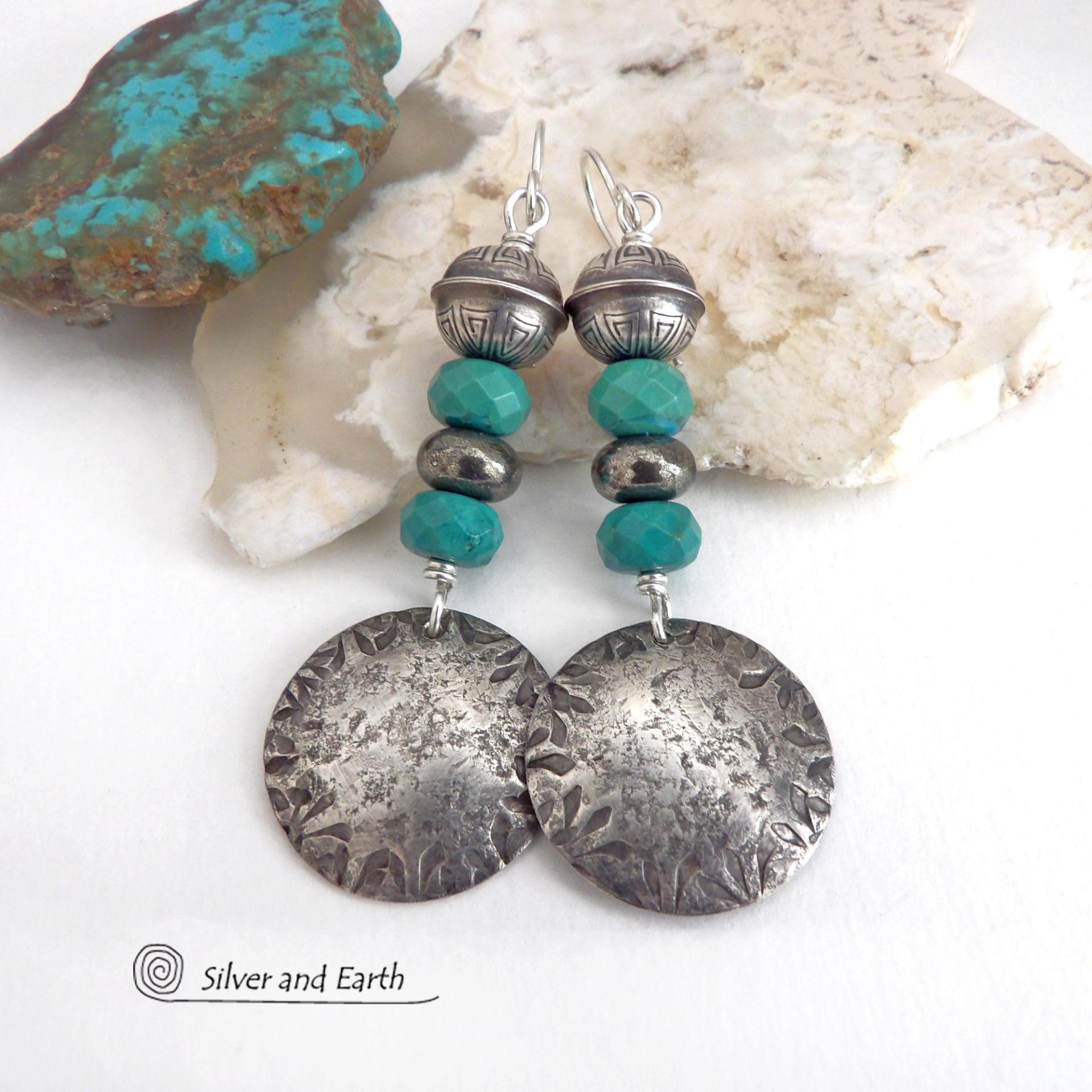 These sterling silver earrings have a southwest Santa Fe style and feature a stack of faceted blue turquoise gemstones and gray pyrite gemstones and are topped off with Native American made stamped sterling silver beads. Unique, bold and striking -- they're sure to make a statement. Perfect for anyone that loves southwest style jewelry. The earrings are handmade and are a beautiful example of southwest style jewelry. Handmade by Silver and Earth, a New Mexico True Certified business.