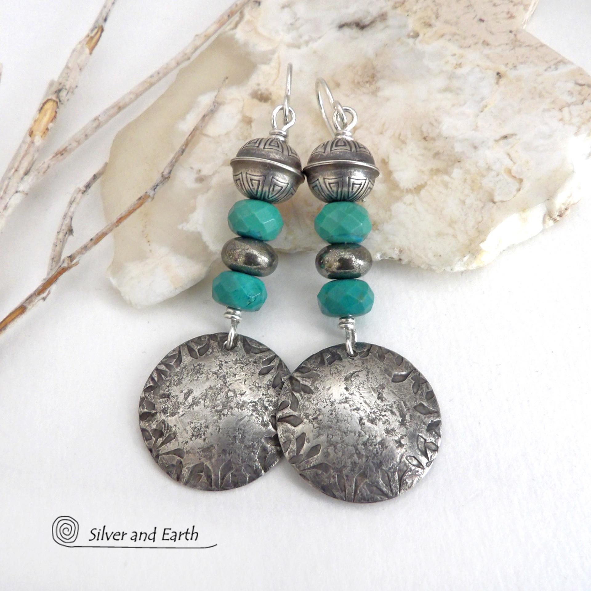 These sterling silver earrings have a southwest Santa Fe style and feature a stack of faceted blue turquoise gemstones and gray pyrite gemstones and are topped off with Native American made stamped sterling silver beads. Unique, bold and striking -- they're sure to make a statement. Perfect for anyone that loves southwest style jewelry. The earrings are handmade and are a beautiful example of southwest style jewelry. Handmade by Silver and Earth, a New Mexico True Certified business.