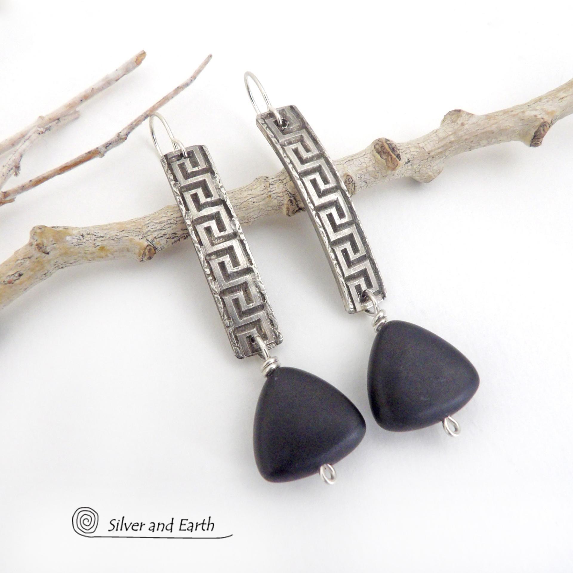These handcrafted sterling silver earrings have a Greek key pattern and are accented with triangular-shaped black onyx stones with a matte finish. They have a contemporary modern vibe that coordinates beautifully with all wardrobe styles.Bold and unique, these earrings are perfect for women that love unusual jewelry. Handmade by SilverandEarth Jewelry.