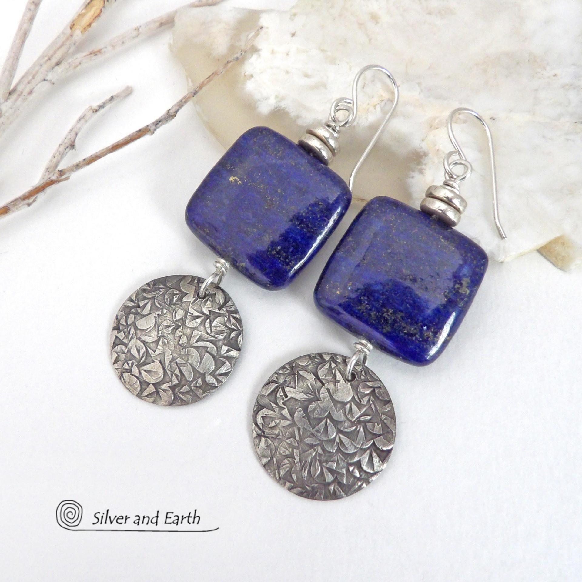 These earrings feature natural lapis lazuli gemstones accented with textured sterling silver dangles. The stones have a beautiful deep blue hue with natural pyrite inclusions. They are topped off with tiny pewter beads. The design is modern, classic, elegant and always in style. They'll coordinate beautifully with all wardrobe types. Handmade in the USA by Silver and Earth Jewelry. 