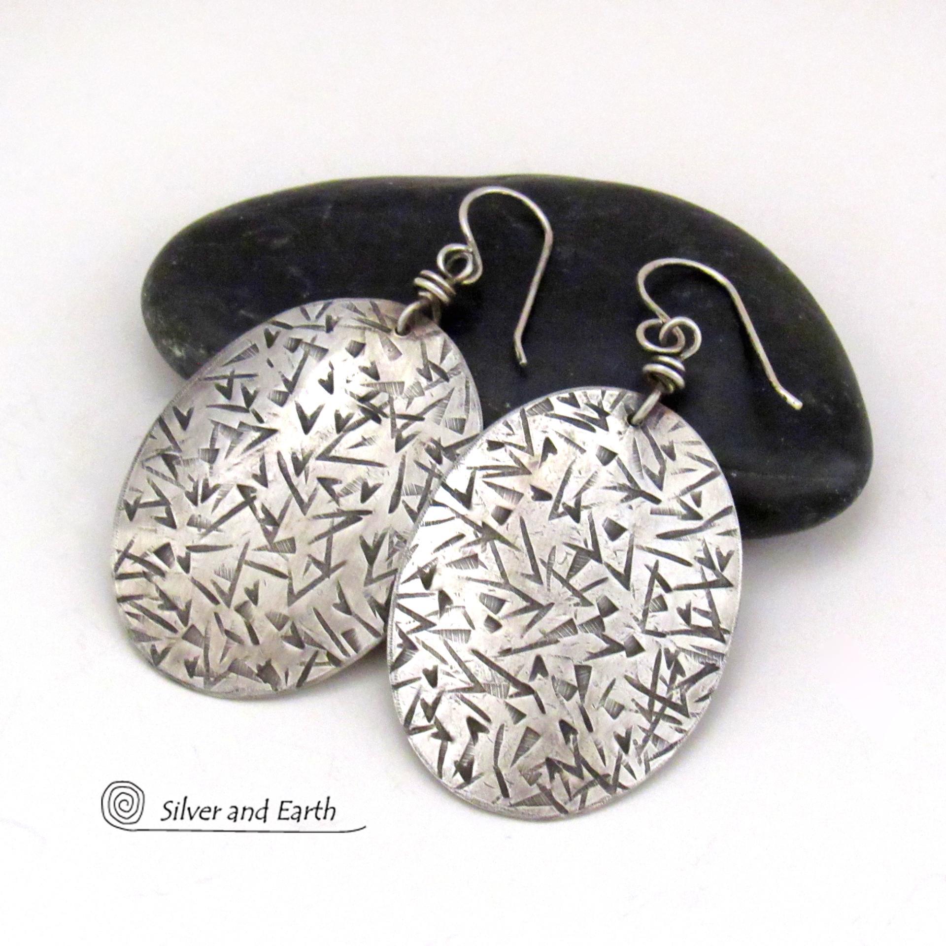 These large sterling silver dangle earrings have a modern, contemporary feel. Perfect "go to" earrings that can be worn everyday with all wardrobe types.