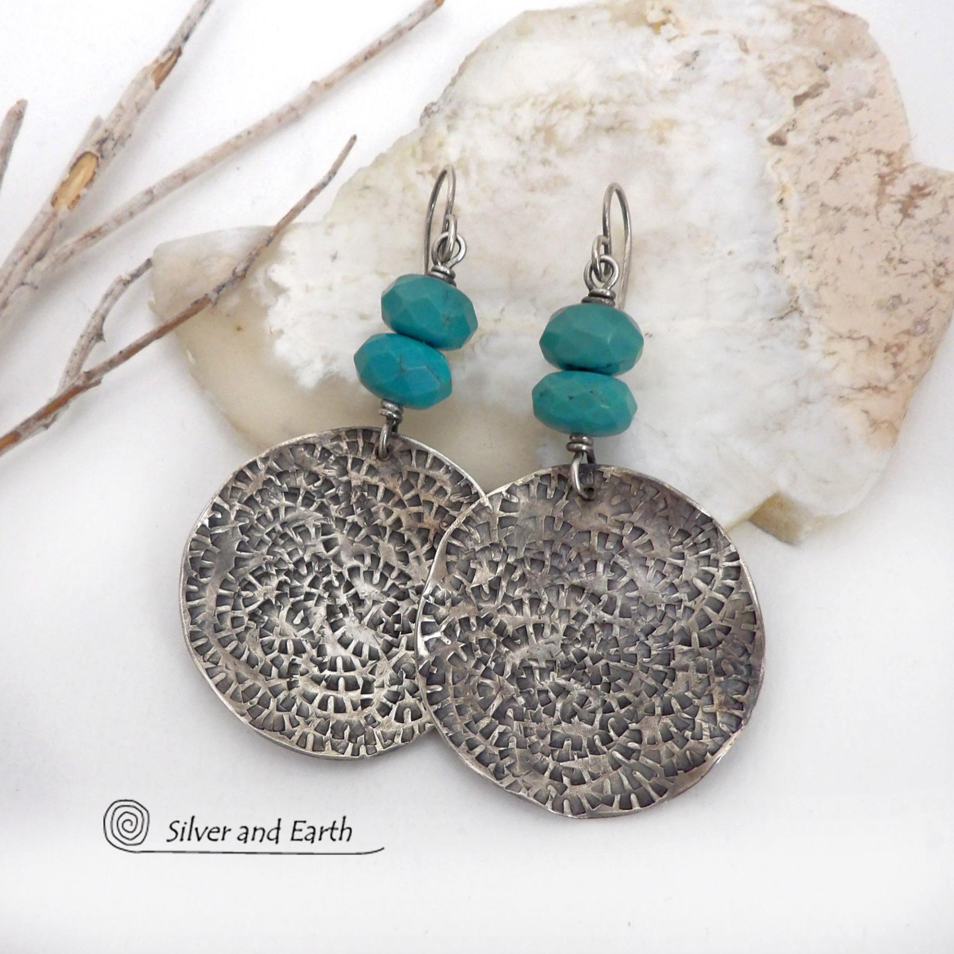 These handcrafted earrings feature large sterling silver round dangles with a hand stamped texture accented with natural turquoise gemstones with a faceted finish. Big and bold, they have a modern style with southwestern flair that looks great with all wardrobe types. Perfect for women that love large earrings and bold statement jewelry. Handmade in the USA by Silver and Earth Jewelry, a New Mexico True Certified business.