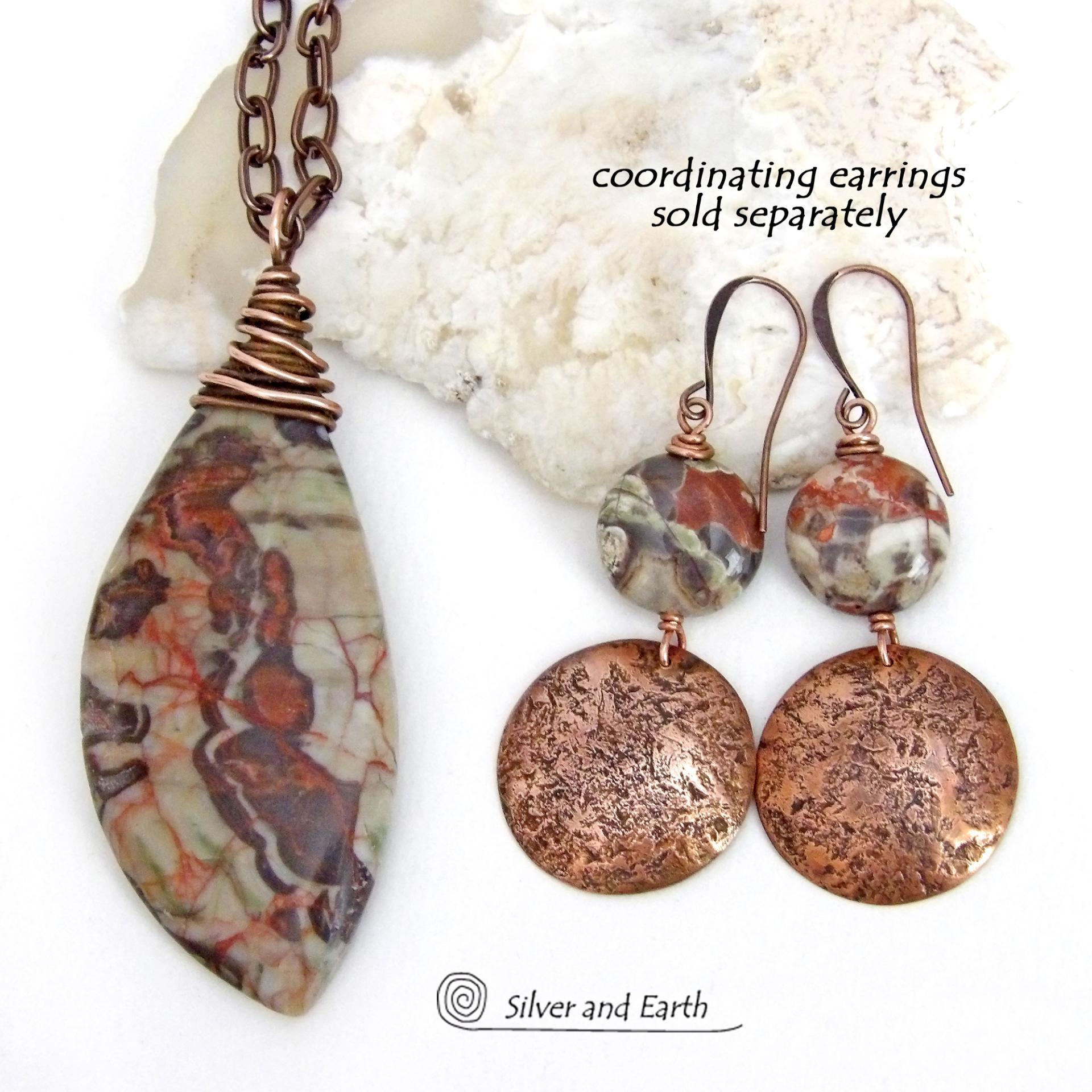 This necklace features a natural rhyolite jasper stone with a natural pattern in earthy hues of rusty orange, brown and taupe. It is wrapped in oxidized copper wire and comes on an 18" copper chain necklace. It has an earthy, natural style and will make a great gift for a natural stone lover - or a nice addition to your own jewelry collection. The chain can be removed from the pendant and worn with other pendants in your wardrobe. Coordinating earrings sold separately. 