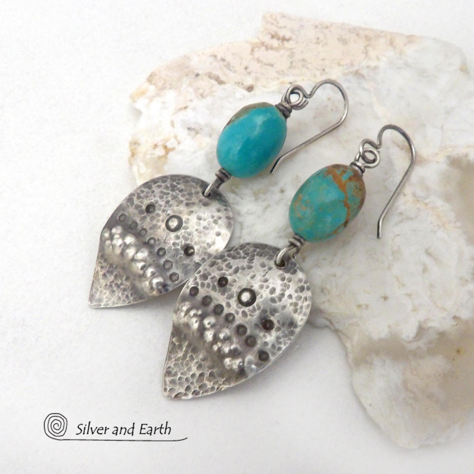 These handcrafted earrings feature natural turquoise nuggets accented with sterling silver dangles with a hammered and hand stamped texture. The stones are a gorgeous shade of turquoise with a natural copper matrix. They have an earthy organic, modern style with southwestern flair. The earrings are handmade and are a beautiful example of southwest style jewelry. Handmade by Silver and Earth, a New Mexico True Certified business.