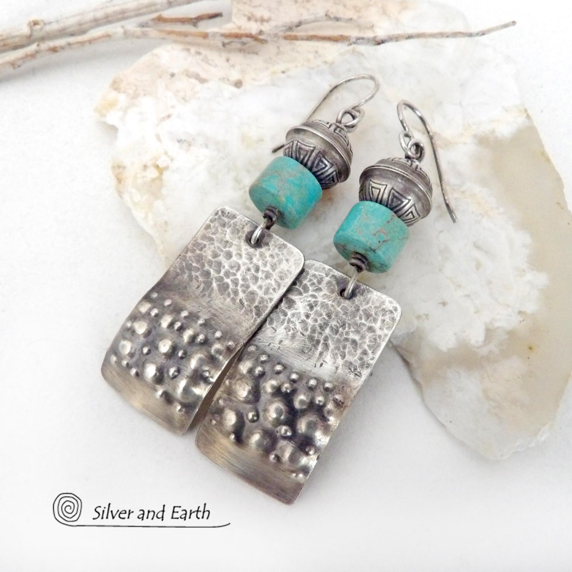 These handcrafted earrings feature sterling silver rectangles with a hammered and hand stamped texture accented with natural turquoise stones. They are topped off with oxidized and stamped Native American made sterling silver beads.They have a modern, southwest tribal style and will make a bold statement. Perfect for anyone that loves southwest style jewelry. The earrings are handmade and are a beautiful example of southwest style jewelry. Handmade by Silver and Earth, a New Mexico True Certified business.