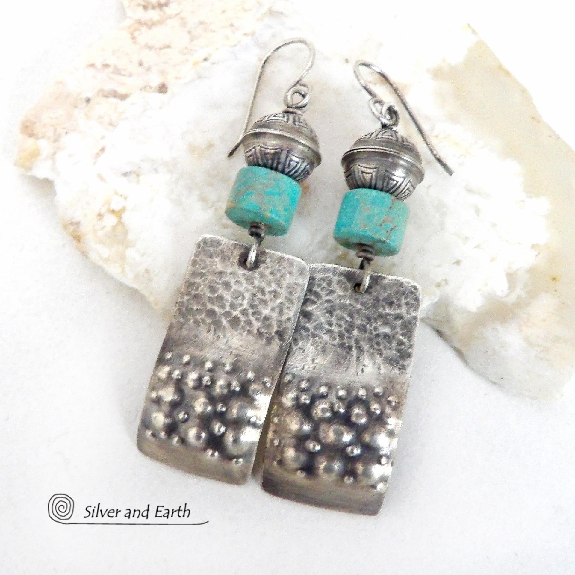 These handcrafted earrings feature sterling silver rectangles with a hammered and hand stamped texture accented with natural turquoise stones. They are topped off with oxidized and stamped Native American made sterling silver beads.They have a modern, southwest tribal style and will make a bold statement. Perfect for anyone that loves southwest style jewelry. The earrings are handmade and are a beautiful example of southwest style jewelry. Handmade by Silver and Earth, a New Mexico True Certified business.