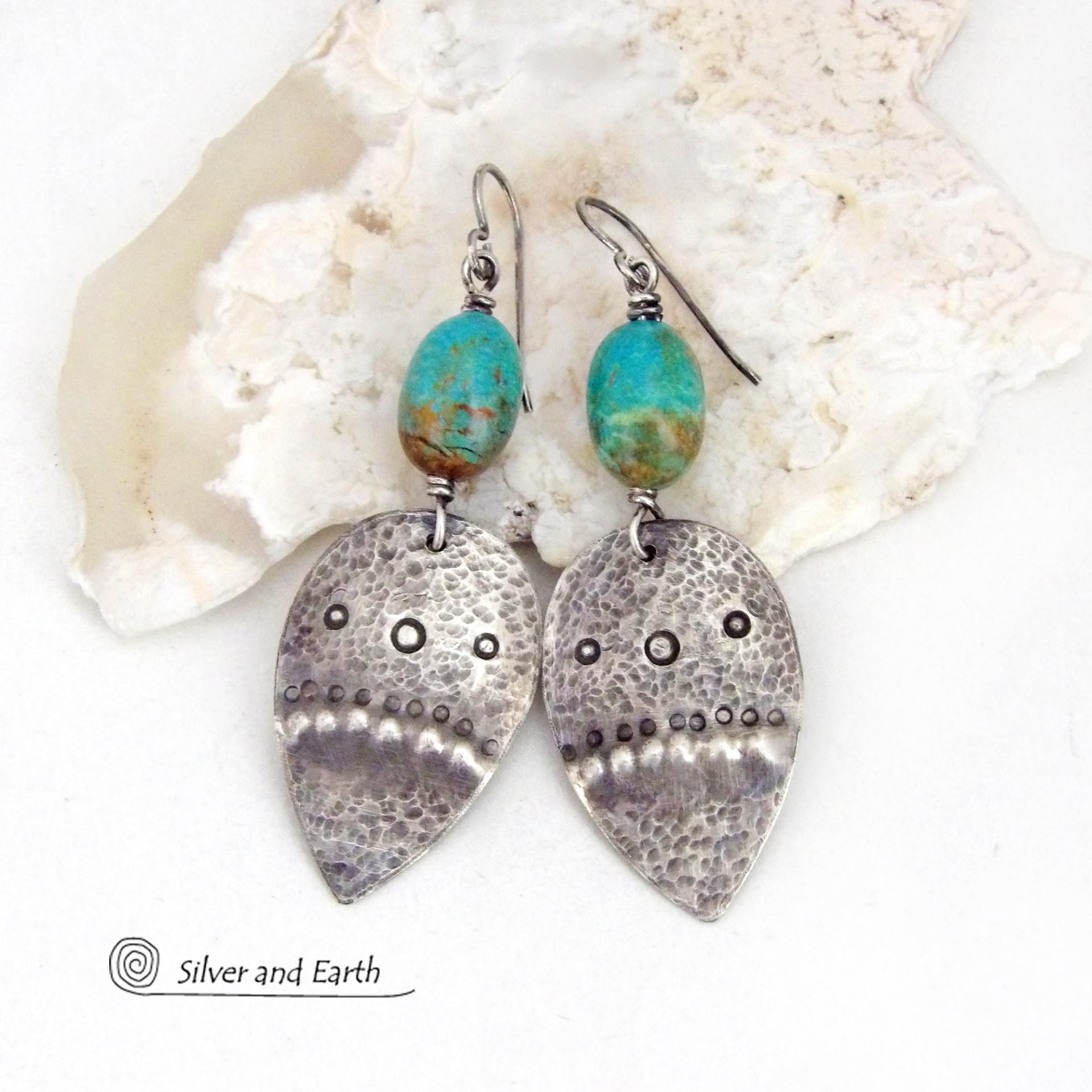 These handcrafted earrings feature natural turquoise nuggets accented with sterling silver dangles with a hammered and hand stamped texture. The stones are a gorgeous shade of turquoise with a natural copper matrix. They have an earthy organic, modern style with southwestern flair.