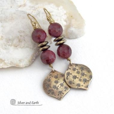 These handcrafted gold brass earrings have a hand stamped texture accented with micro-faceted deep burgundy mookaite gemstones and faceted hematite stone beads with an electroplated champagne gold tone finish. Mookaite is a unique, colorful type of jasper found at the Mooka Creek in Western Australia. These earrings have an elegant modern chic style that coordinates beautifully with all wardrobe types - dressed up or down. Handmade in the USA by Silver and Earth Jewelry.