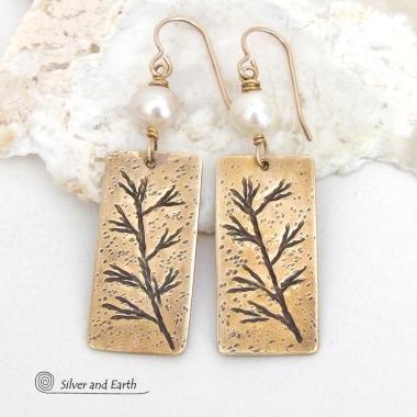 These artisan handmade earrings feature handcrafted gold brass rectangles with a hand stamped twig design accented with white pearls. They have a modern, earthy and elegant style and will make a great gift for a nature lover. They'll also make a great gift for someone born in June. Pearl is the traditional gemstone for this month. 