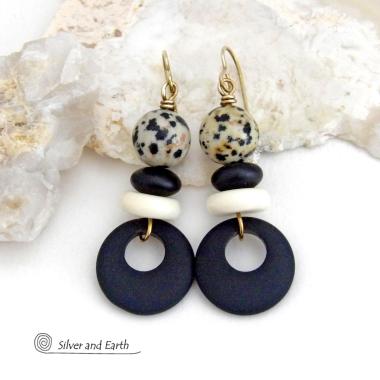 These handcrafted earrings feature matte black glass circle hoops accented with Dalmatian jasper gemstones, African bone and black glass beads. Unique and fun to wear, they have an earthy natural style with boho chic flair that makes a striking statement. They'll make a great gift for a natural stone lover - or a nice addition to your own jewelry wardrobe. 
