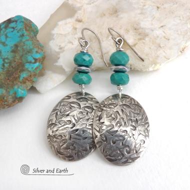 Handcrafted earrings with sterling silver oval dangles with a hand stamped texture accented with natural turquoise and hematite gemstones. The stones have a faceted finish which casts off a natural sparkle and shine. They have a modern style with southwestern flair that looks great with all wardrobe types. Perfect for women that love modern style southwest jewelry. Handmade in the USA by Silver and Earth Jewelry, a New Mexico True Certified business.